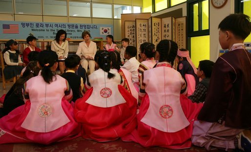 Laura Bush reads to kids in the Children's Reading Room at the Busan Simin Metropolitan Municipal Library Friday, Nov. 18, 2005. White House photo by Shealah Craighead
