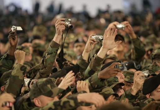 A sea of cameras and hands greet President Bush upon his arrival Saturday, Nov. 19, 2005, to Osan Air Base in Osan, Korea. White House photo by Eric Draper