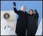 President and Mrs. Bush wave from the top of the steps as they deplane Air Force One Monday, Nov. 21, 2005, in Ulaanbaatar, Mongolia. The stop marks the first time a working U.S. president has visited the country. White House photo by Paul Morse