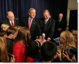 President George W. Bush invites children on stage, Tuesday, November 22, 2005, to pet "Marshmallow", the National Thanksgiving Turkey, at the official pardoning of the turkey at the Eisenhower Executive Office Building in Washington.  White House photo by David Bohrer