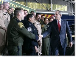 President George W. Bush meets with U.S. Customs and Border Protection officials following his address Monday, Nov. 28, 2005 at the Davis-Monthan Air Force Base in Tucson, Arizona, speaking on the importance of border security and the issue of immigration reform.  White House photo by Eric Draper