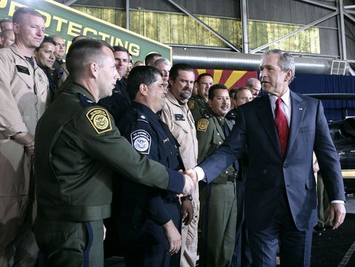 President George W. Bush meets with U.S. Customs and Border Protection officials following his address Monday, Nov. 28, 2005 at the Davis-Monthan Air Force Base in Tucson, Arizona, speaking on the importance of border security and the issue of immigration reform. White House photo by Eric Draper