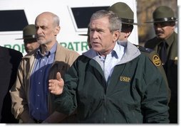 President George W. Bush delivers a statement on Border Security following a tour of the El Paso Sector of the US-Mexico border region, Tuesday, Nov. 29, 2005. Also pictured at left is Homeland Security Secretary Michael Chertoff.  White House photo by Eric Draper