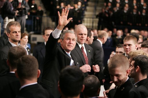 President Bush waves to the crowd after delivering an emphatic statement on the War on Terror Wednesday, Nov. 30, 2005, at the U.S. Naval Academy in Annapolis. "Victory in Iraq will demand the continued determination and resolve of the American people," said the President. White House photo by Paul Morse