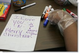 A personal note is written on a sandwich bag by a student Wednesday, Nov. 30, 2005 during a visit to the Church of the Epiphany in Washington by Laura Bush, as part of her Helping America's Youth initiative. The students, part of the Youth Service Learning Project, were preparing sandwiches for the homeless.  White House photo by Shealah Craighead