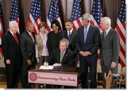 President George W. Bush is seen Thursday, Dec. 1. 2005 in the Eisenhower Executuive Office Building in Washington, as he signs H.R. 4145, to Direct the Joint Committee on the Library to Obtain a Statue of Rosa Parks, which will be placed in the US Capitol's National Statuary Hall. The President is joined by, from left to right, U.S. Sen. Richard G. Lugar, R-Ind., U.S. Secretary of Housing and Urban Development Alphonso Jackson, Mrs. Laura Bush, U.S. Secretary of State Condoleezza Rice, U.S. Rep. Jesse Jackson Jr., D-Ill., U.S. Sen. John Kerry, D-Mass., and U.S. Sen. Thad Cochran, R-Miss.  White House photo by Paul Morse