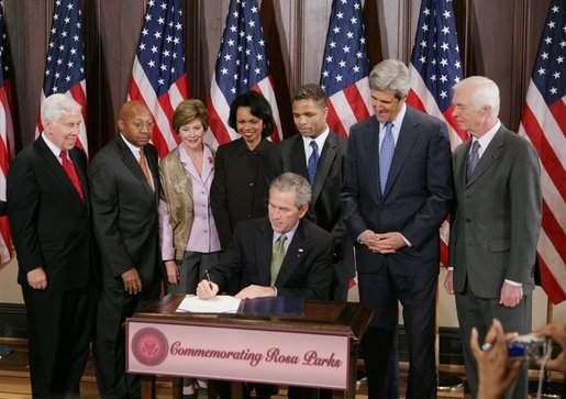 President George W. Bush is seen Thursday, Dec. 1. 2005 in the Eisenhower Executuive Office Building in Washington, as he signs H.R. 4145, to Direct the Joint Committee on the Library to Obtain a Statue of Rosa Parks, which will be placed in the US Capitol's National Statuary Hall. The President is joined by, from left to right, U.S. Sen. Richard G. Lugar, R-Ind., U.S. Secretary of Housing and Urban Development Alphonso Jackson, Mrs. Laura Bush, U.S. Secretary of State Condoleezza Rice, U.S. Rep. Jesse Jackson Jr., D-Ill., U.S. Sen. John Kerry, D-Mass., and U.S. Sen. Thad Cochran, R-Miss. White House photo by Paul Morse