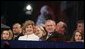 President George W. Bush and Laura Bush watch the holiday entertainment, Thursday evening, Dec. 1, 2005, during the Pageant of Peace and the lighting of the National Christmas Tree on the Ellipse in Washington. White House photo by Paul Morse