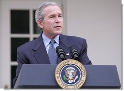 President George W. Bush is seen in the Rose Garden of the White House, Friday, Dec. 2, 2005, as he speaks on the growth of the economy with news of 215,000 jobs added for the month of November and third-quarter growth this year was 4.3 percent.  White House photo by Paul Morse