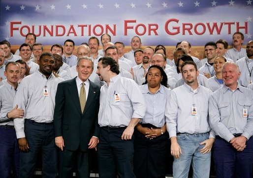 President George W. Bush greets workers following his remarks on the economy and tax relief in Kernersville, N.C., where he toured the John Deere-Hitachi excavator assembly line, Monday, Dec. 5, 2005. White House photo by Eric Draper