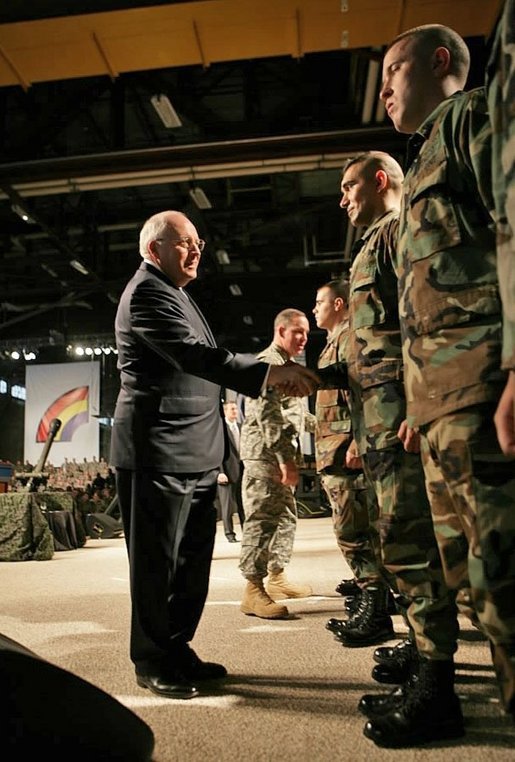 Vice President Dick Cheney congratulates troops during a Re-enlistment Ceremony at Fort Drum, N.Y., Tuesday, Dec. 6, 2005. During his visit, the Vice President also participated in a Purple Heart Award Ceremony and met one-on-one with troops. White House photo by David Bohrer