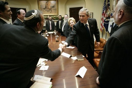 President George W. Bush welcomes Jewish educational leaders to a meeting Tuesday, Dec. 6, 2005 in the Roosevelt Room at the White House. The group will also be attending the White House Hanukkah Reception, Tuesday evening. White House photo by Eric Draper
