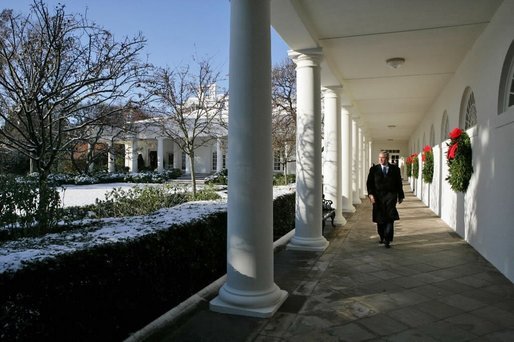 President George W. Bush takes a brisk walk along the colonnade in the Rose Garden Friday morning, Dec. 9, 2005. White House photo by Kimberlee Hewitt
