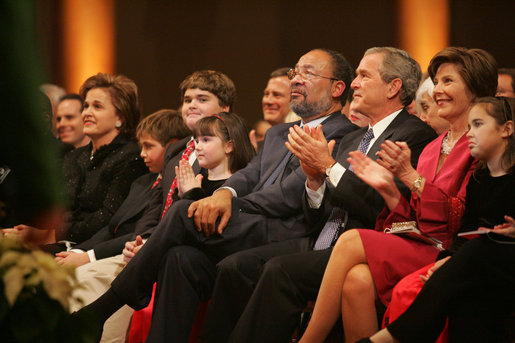 President George W. Bush and Laura Bush join in the applause as they celebrate the 24th Annual Christmas in Washington Sunday, Dec. 11, 2005, at the National Building Museum in Washington. White House photo by Shealah Craighead