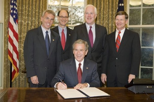 President George W. Bush is joined in the Oval Office, from left to right, by U.S. Rep. Todd Platts, R-Pa., U.S. Rep. Brad Sherman, D-Calif., U.S. Senator John Cornyn, R-Texas, and U.S. Rep. Lamar Smith, R-Texas, at the signing Wednesday, Dec. 14, 2005 of the Executive Order Improving Agency Disclosure of Information. White House photo by Paul Morse