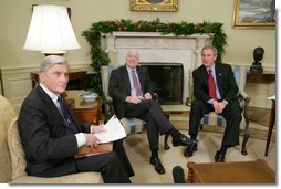 President George W. Bush meets with U.S. Senator John McCain, R-Ariz., and U.S. Senator John Warner, R-Va., Thursday, Dec. 15, 2005 in the Oval Office, to discuss the U.S. position on the interrogation of prisoners. White House photo by Paul Morse