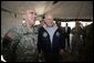 Vice President Dick Cheney has lunch with US and Iraqi troops at the 9th Mechanized Infantry Division Headquarters, a training facility for Iraqi troops, Sunday Dec 18, 2005. White House photo by David Bohrer