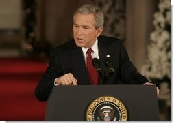 President George W. Bush emphasizes a point as he responds to a reporter's question Monday, Dec. 19, 2005, during a news conference in the East Room of the White House.  White House photo by Kimberlee Hewitt