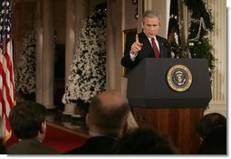 President George W. Bush emphasizes a point as he responds to a reporter's question Monday, Dec. 19, 2005, during a news conference in the East Room of the White House.  White House photo by Kimberlee Hewitt