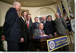 President George W. Bush smiles as he signs into law H.R. 2520, the Stem Cell Therapeutic and Research Act of 2005, during ceremonies Tuesday, Dec. 20, 2005, in the Roosevelt Room of the White House.  White House photo by Paul Morse