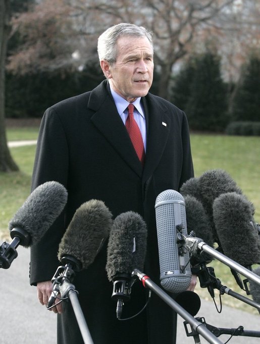 President George W. Bush speaks to the media Thursday, Dec. 22, 2005, on the South Lawn of the White House before leaving for Camp David. The President spoke about the Patriot Act extension saying, "We're still under threat, there's still an enemy that wants to harm us and they understand the Patriot Act is an important tool for those of us here in the Executive Branch to use to protect our fellow citizens." White House photo by Kimberlee Hewitt