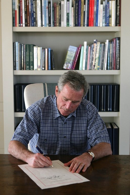President George W. Bush signs into law H.R. 3010, the "Departments of Labor, Health and Human Services, and Education, and Related Agencies Appropriations Act, 2006" from the Bush ranch Friday, Dec. 30, 2005, in Crawford, Texas. White House photo by Shealah Craighead