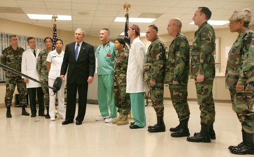 President George W. Bush speaks with the press on Sunday, January 1, 2006, at Brooke Army Medical Center in San Antonio, TX. During his visit to the Medical Center, the President presented nine soldiers with a Purple Heart Award and visited with wounded soldiers and their families. White House photo by Shealah Craighead