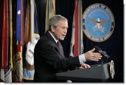 President George W. Bush gestures as he addresses his remarks on the global war on terror, Wednesday, Jan. 4, 2006, to an audience at the Pentagon, following a Department of Defense briefing with Secretary of Defense Donald Rumsfeld and Joint Chiefs of Staff General Peter Pace.  White House photo by Eric Draper