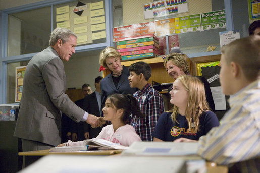 President George W. Bush and Education Secretary Margaret Spellings visit with students at North Glen Elementary School in Glen Burnie, Md., Monday, Jan. 9, 2006. "This is a fine school," said the President in his remarks about 'No Child Left Behind' at the school. "We're here to herald excellence. We're here to praise the law that is working. I'm here to thank the teachers, not only here, but around the state of Maryland and around the country, who are dedicating their lives to providing hope for our future." White House photo by Kimberlee Hewitt
