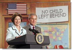 Laura Bush and President Bush discuss “No Child Left Behind,” at North Glen Elementary School in Glen Burnie, Md., Monday, Jan. 9, 2006. “Interestingly enough, in 2003, 45 percent of the African American students in this school rated proficient in reading; in 2005, 84 percent are proficient. In other words, this is a school that believes every child can learn. Not just certain children, every child,” said the President. White House photo by Kimberlee Hewitt