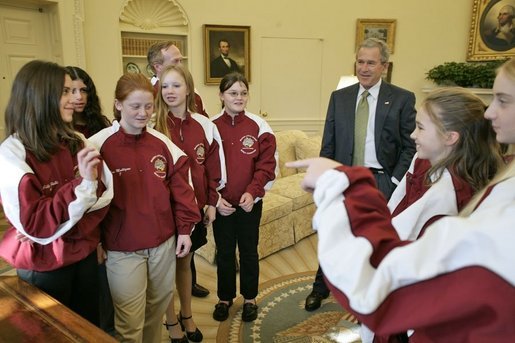 President George W. Bush hosts a visit to the Oval Office by the 2005 Little League Softball World Series Champions Tuesday, Jan. 10, 2006. The All-Star team of 11- and 12-year-old girls is based in McLean, Va., and represents the South Region of the United States. White House photo by Eric Draper