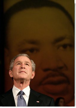 President George W. Bush looks up at the audience while taking the stage before his remarks at Georgetown University's "Let Freedom Ring" Celebration Honoring Dr. Martin Luther King at the John F. Kennedy Center for the Performing Arts, Monday, Jan. 16, 2006. White House photo by Eric Draper