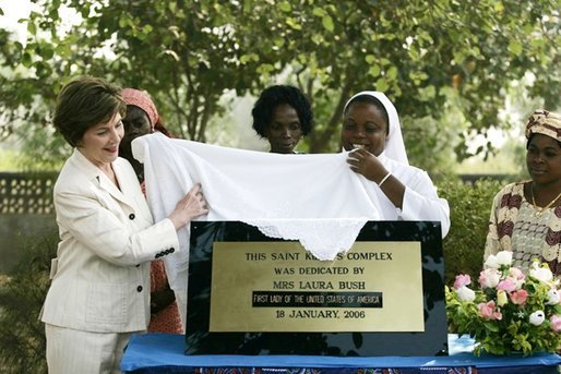 Mrs. Laura Bush helps unveil a plaque dedicating the Saint Kizito Complex at Saint-Mary's Catholic Church in Gwagwalada, Nigeria Wednesday, Jan. 18, 2006. White House photo by Shealah Craighead