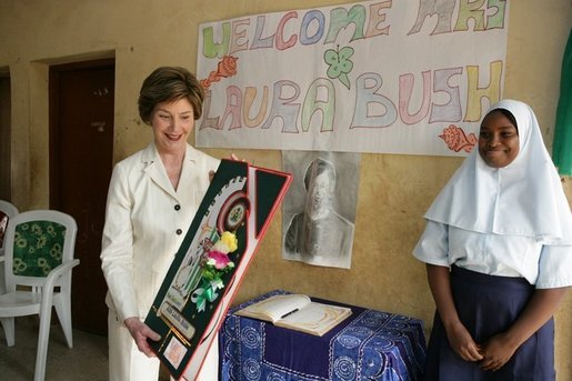 Laura Bush admires a gift presented to her at the conclusion of her visit to the Model Secondary School in Abuja, Nigeria, January 18, 2006. White House photo by Shealah Craighead