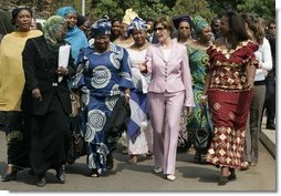 Laura Bush walks with members of the National Center for Women's Development in Abuja, Nigeria to the Women's Hall of Fame January 18, 2006.  White House photo by Shealah Craighead