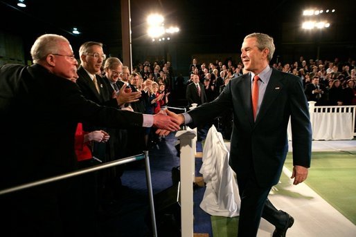 President George W. Bush greets the audience following his remarks on the economy at JK Moving and Storage in Sterling, Va., Thursday, Jan. 19, 2006. White House photo by Eric Draper