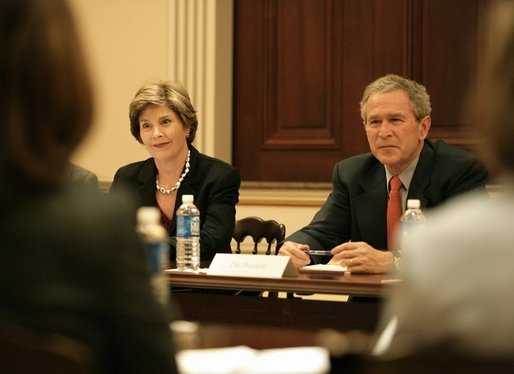 President George W. Bush and Mrs. Bush listen during meeting with heads of foundations to help aid Gulf Coast Recovery at the White House, Thursday, Jan. 19, 2006. White House photo by Eric Draper