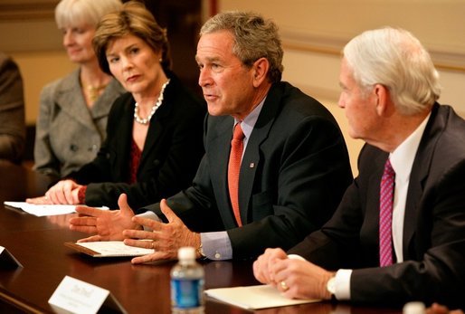 President George W. Bush, with Mrs. Bush, speaks to the press during a meeting with foundations to help aid Gulf coast Recovery at the White House, Thursday, Jan. 19, 2006. White House photo by Eric Draper