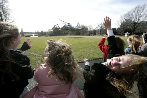 Students from Loudoun Country Day School react as they view the departure of Marine One with President George W. Bush aboard on the South Lawn, Friday, Jan. 20, 2006. White House photo by Eric Draper