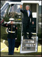 President George W. Bush waves to guests on the South Lawn before departing for Camp David aboard Marine One, Friday, Jan. 20, 2006. White House photo by Eric Draper