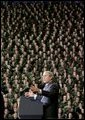 President George W. Bush delivers remarks on the global war on terror at Kansas State University in Manhattan, Kan., Monday, Jan. 23, 2006. Pictured behind the President are 1,000 military personnel from Fort Riley, Kan. White House photo by Eric Draper