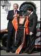President George W. Bush is presented with his own racing suit by 2005 NASCAR Nextel Cup Champion Tony Stewart, Tuesday, Jan. 24, 2006 on the South Lawn at the White House. White House photo by Eric Draper