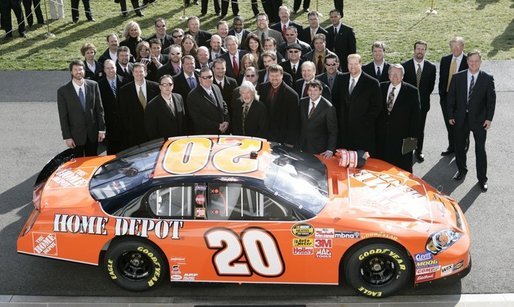 President George W. Bush poses with 2005 NASCAR Nextel Cup Champion team and their car, Tuesday, Jan. 24, 2006 on the South Lawn driveway at the White House. White House photo by Eric Draper