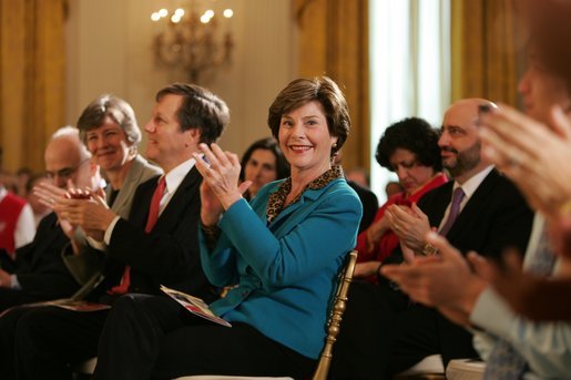 Laura Bush applauds The Moving in the Spirit dancers performance Wednesday, Jan. 25, 2006 in the East Room of the White House, during the President's Committee on the Arts and the Humanities 2006 Coming Up Taller Awards ceremony. White House photo by Paul Morse