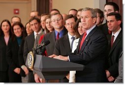 President George W. Bush stands with former law clerks of Judge Samuel Alito as he delivers a statement in the Dwight D. Eisenhower Executive Office Building Wednesday, Jan. 25, 2006. "All these brilliant legal minds are united in their strong support of Sam Alito, And in his confirmation hearings, the American people saw why. Judge Alito is open-minded and principled," said the President. "He gives every case careful attention, and he makes decisions based on the merits. Judge Alito understands that the role of a judge is to interpret the law, not to advance a personal or political agenda."  White House photo by Paul Morse