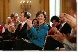 Laura Bush applauds The Moving in the Spirit dancers performance Wednesday, Jan. 25, 2006 in the East Room of the White House, during the President's Committee on the Arts and the Humanities 2006 Coming Up Taller Awards ceremony.  White House photo by Paul Morse