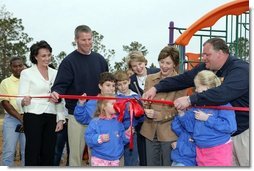 Laura Bush attends a ribbon cutting ceremony with football star Brett Favre and his wife, Deanna, left, Secretary Margaret Spellings, center, Dan Vogel, Associate Director, USA Freedom Corps, right, and student of Hancock North Central Elementary Shool at the Kaboom Playground, built at the Hancock North Central Elementary School in Kiln, Ms., Wednesday, Jan. 26, 2006, during a visit to the area ravaged by Hurricane Katrina. White House photo by Shealah Craighead