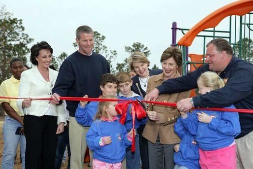 Laura Bush attends a ribbon cutting ceremony with football star Brett Favre and his wife, Deanna, left, Secretary Margaret Spellings, center, Dan Vogel, Associate Director, USA Freedom Corps, right, and student of Hancock North Central Elementary Shool at the Kaboom Playground, built at the Hancock North Central Elementary School in Kiln, Ms., Wednesday, Jan. 26, 2006, during a visit to the area ravaged by Hurricane Katrina. White House photo by Shealah Craighead
