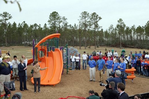 Laura Bush addresses a gathering to dedicate the new Kaboom Playground, built at the Hancock North Central Elementary School in Kiln, Ms., Wednesday, Jan. 26, 2006, during a visit to the area ravaged by Hurricane Katrina. White House photo by Shealah Craighead