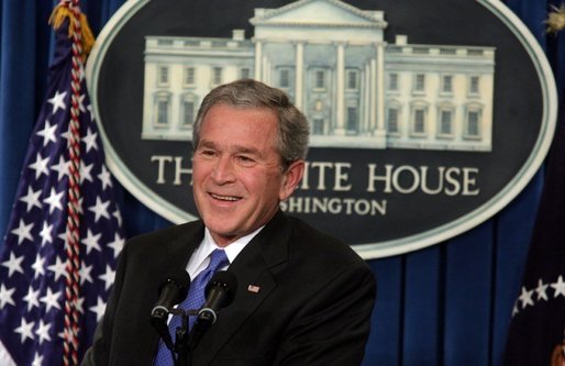 President George W. Bush smiles as he listens to reporter's question Thursday, Jan. 26, 2006, during a press conference at the White House that covered several topics including economy, the upcoming election year and fiscal policy. White House photo by Kimberlee Hewitt